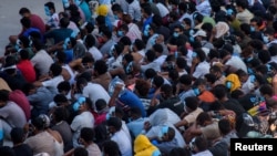 ຮູບຂອງຜູ້ຕົກເປັນເຫຍື່ອຂອງເຄືອຂ່າຍແກັ່ງອາຊະຍາກອນຄອລເຊັນເຕີ ໃນເມືອງມຽວວະດີ ທີ່ໄດ້ຮັບການຊ່ອຍເຫຼືອໃຫ້ມາພັກລໍຖ້າການສົ່ງກັບຄືນປະເທດທີ່ສູນຕ່າງໆ ໃນມຽວວະດີ ປະເທດມຽນມາ.