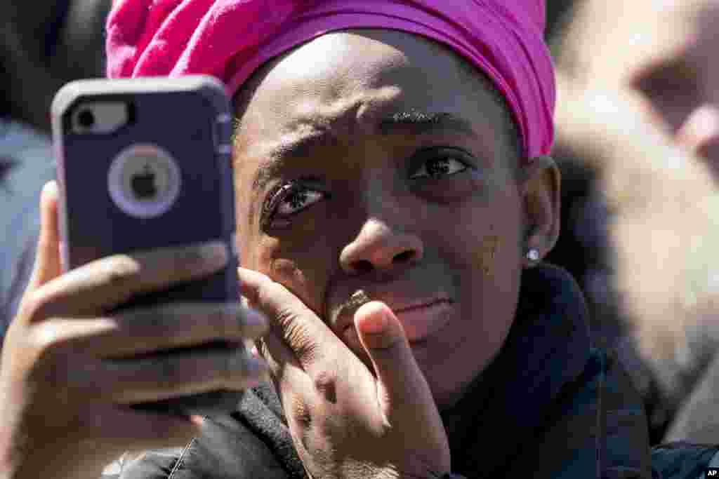 A member of the audience becomes emotional as Zion Kelly, of Washington, who lost his twin brother Zaire to gun violence in 2017, speaks during the "March for Our Lives" rally in Washington, March 24, 2018.