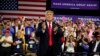 FILE - President Donald Trump arrives to speak at a campaign rally at Florida State Fairgrounds Expo Hall, July 31, 2018, in Tampa, Fla. 