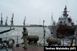 UKRAINE -- A Ukrainian serviceman stands on board a coast guard ship in the Sea of Azov port of Mariupol, eastern Ukraine, December 3, 2018