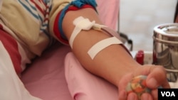 一名獻血資料照。