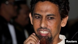 FILE - Indonesian militant Umar Patek walks after reading his final defense at the West Jakarta court May 31, 2012.