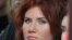 In this Sunday, Oct. 30, 2011 photo Anna Chapman, who was deported from the U.S. on charges of espionage, seen during the displaying of creation by Russian designer Ilia Shiyan at the Volvo Fashion Week Moscow, Russia. A year and a half after the biggest 