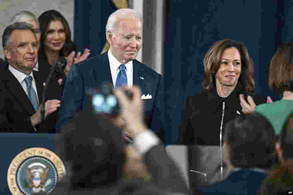 President Joe Biden, left, and Vice President Kamala Harris arrive for the 60th Presidential Inauguration in the Rotunda of the U.S. Capitol in Washington, Jan. 20, 2025.