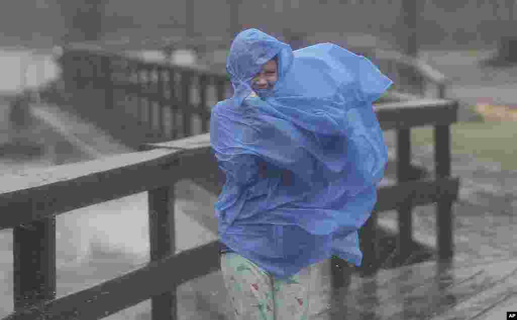 Alora Goldsmith, 10, battles the wind and rain as the effects of Hurricane Irene are felt in Elizabeth City, North Carolina, August 27, 2011 (AP)