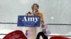 Democratic Sen. Amy Klobuchar, left, addresses a snowy rally where she announced she is entering the race for president, Feb. 10, 2019, at Boom Island Park in Minneapolis. 