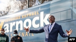 Georgia Senatorial candidate Reverend Raphael Warnock speaks to supporters at a canvassing event on January 5, 2021 in Marietta, Georgia.