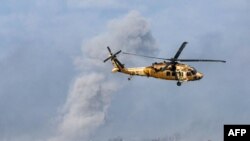 以色列军队2023年12月6日在加沙南部与哈马斯武装分子激战。（法新社）