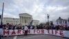 Participants in the annual March for Life pose in front of the U.S. Supreme Court in Washington, Jan. 24, 2025.
