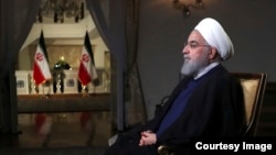資料照： 伊朗總統魯哈尼。 2018年8月6日