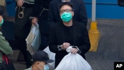 譚得志（中）資料照片。