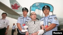 2011年流亡富商赖昌星被从加拿大押回北京（路透社）