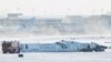 The wreckage of a Delta Air Lines-operated CRJ900 aircraft lays on the runway after a plane crash at Toronto Pearson International Airport in Mississauga, Ontario, Canada, Feb. 18, 2025. 