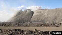 FILE - A mining machine is seen at the Bayan Obo mine containing rare earth minerals, in Inner Mongolia, China, July 16, 2011. 
