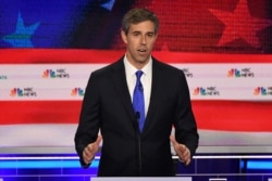 FILE - Democratic presidential hopeful Beto O'Rourke, a former U.S. Representative for Texas' 16th Congressional District, participates in the first Democratic primary debate of the 2020 presidential campaign in Miami, June 26, 2019.