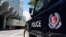 FILE - A police vehicle is seen parked on a street in Singapore, May 31, 2019.