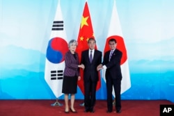资料照：中日韩三国曾在北京举行外长会议。（2019年8月21日）