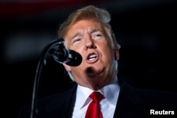 U.S. President Donald Trump speaks during a campaign rally at Southern Illinois Airport in Murphysboro, Illinois, Oct. 27, 2018.
