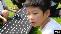 主動參與學民思潮反對國民教育活動的12歲升讀中學一年級學生劉焌朗