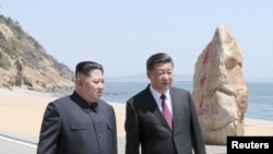 北韓領導人金正恩與美國總統特朗普2018年6月舉行峰會前先到中國大連會晤習近平。(資料圖片)