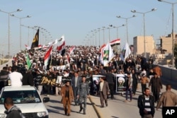 伊拉克什叶派穆斯林在巴格达抗议沙特阿拉伯处决尼姆尔