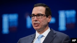 姆努钦2018年4月30日出席一场活动（美联社）