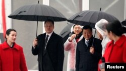 时任上海市长应勇和特斯拉CEO马斯克在上海出席投资50亿美元的特斯拉电动车超级工厂破土动工典礼（路透社2019年1月7日资料照）。