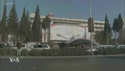 ເມື່ອ ທ່ານ ອາຊາດ ຖືກຂັບໄລ່ອອກຈາກອໍານາດ, ຍຸກໃໝ່ກໍເລີ້ມຕົ້ນຂຶ້ນໃນ ຊີເຣຍ ໃນຂະນະທີ່ໂລກເຝົ້າຕິດຕາມເບິ່ງ