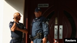 Police officers stand outside the Panamanian Supreme Court of Justice where the tax evasion trial known as 'Panama Papers' is taking place, which involves former law firm Mossack Fonseca, in Panama City, Panama, April 8, 2024. 