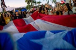 People protest in front of Puerto Rico's Capitol during a demonstration against Puerto Rico Governor Wanda Vazquez and the government in San Juan, Puerto Rico, Jan. 20, 2020.