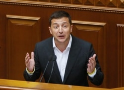 Ukrainian President Volodymyr Zelenskiy speaks to newly elected Ukrainian parliament deputies during parliament session in Kyiv, Aug. 29, 2019.