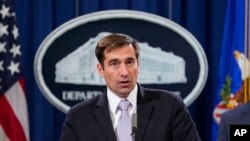 美國助理司法部長約翰德默斯。