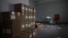 FILE - Boxes of voter registration forms are stacked in a space that the Iowa Democratic Party occupied near its headquarters in Des Moines, Iowa, Feb. 4, 2020.