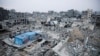 FILE - Houses destroyed in previous Israeli strikes lie in ruin, in Khan Younis in the southern Gaza Strip, Jan. 16, 2025.