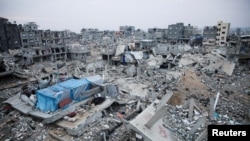 FILE - Houses destroyed in previous Israeli strikes lie in ruin, in Khan Younis in the southern Gaza Strip, Jan. 16, 2025.