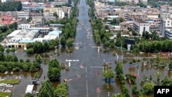 河南新乡卫辉城暴雨成灾后的街道。（2021年7月26日）