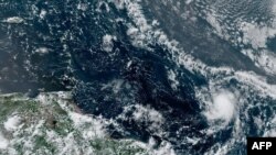 This RAMMB/NOAA satellite image obtained July 22, 2020, shows Tropical Storm Gonzalo (lower right) at 17:10:25 UTC. 