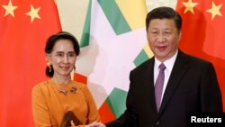 中國國家主席習近平和緬甸領導人昂山素姬。(2017年5月16日。資料圖片)
