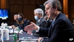 美情報界主管在參議院情報委員會就世界範圍的威脅舉行的聽證會上作證。從左至右為：國家安全局局長中曾根、國家情報總監海恩斯、中央情報局局長伯恩斯和聯邦調查局局長克里斯托弗·雷。(2021年4月14日)