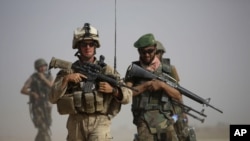 Myanmar&#39;s leader Aung San Suu Kyi, left, listens as Pope Francis delivers his speech at the International Convention Center of Naypyitaw, Nov. 28, 2017.