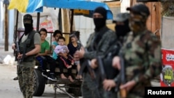 伊斯蘭聖戰者組織戰鬥人員停火後在加沙地帶站崗（2021年5月21日）