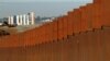 The prototypes for U.S. President Donald Trump's border wall are seen behind the border fence between Mexico and the United States, in Tijuana, Mexico, Jan. 7, 2019. 