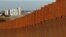 The prototypes for U.S. President Donald Trump's border wall are seen behind the border fence between Mexico and the United States, in Tijuana, Mexico, Jan. 7, 2019. 