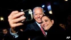 Democratic presidential candidate former Vice President Joe Biden makes a selphie with an attendee during a campaign event, Oct. 23, 2019, in Scranton, Pa. 