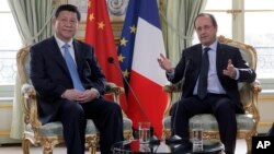 法國總統奧朗德與中國國家主席習近平於2014年3月26日會晤資料照。