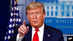 图为美国总统特朗普。（2020年3月26日）