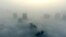 Buildings are seen on a hazy day in Xiangyang, Hubei province, China, Dec. 31, 2016. The current round of air pollution struck Friday and isn't expected to lift until Thursday.