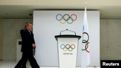 资料图片：2014年7月7日，国际奥委会(IOC)主席托马斯∙巴赫(Thomas Bach)在位于瑞士洛桑的奥委会总部宣布2022年冬奥会候选城市。