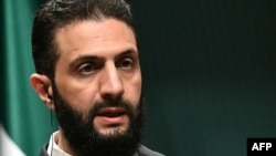 敘利亞過渡政府總統沙拉首度公開會見中國駐大馬士革大使；中國過去多次支持前總統阿薩德。(法新社：2025年2月4日)