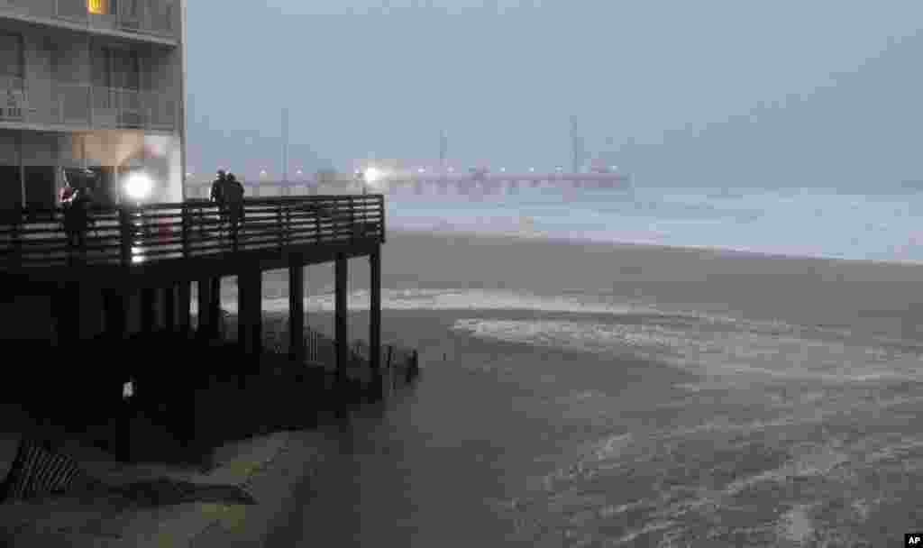 Waves move onto the beach as the Hurricane Irene approaches in Nags Head, North Carolina. (AP Image)